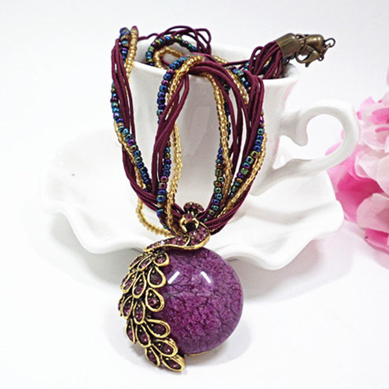 European and American ethnic style imitation beeswax colored shell long sweater chain autumn and winter retro water drop necklace jewelry wholesale