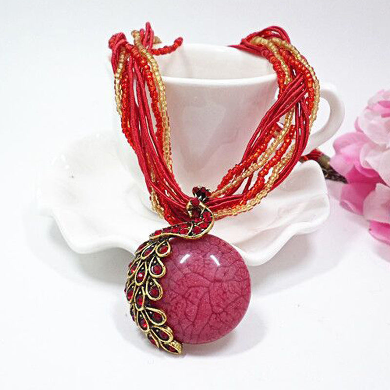 European and American ethnic style imitation beeswax colored shell long sweater chain autumn and winter retro water drop necklace jewelry wholesale