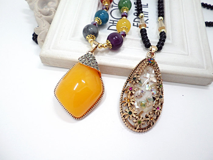 European and American ethnic style imitation beeswax color shell long sweater chain autumn and winter retro water drop necklace jewelry wholesale