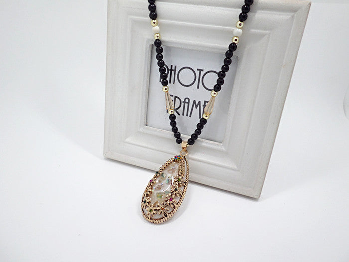 European and American ethnic style imitation beeswax color shell long sweater chain autumn and winter retro water drop necklace jewelry wholesale