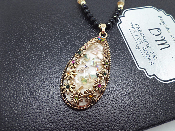 European and American ethnic style imitation beeswax color shell long sweater chain autumn and winter retro water drop necklace jewelry wholesale