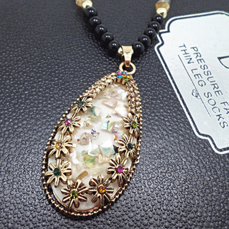 European and American ethnic style imitation beeswax colored shell long sweater chain autumn and winter retro water drop necklace jewelry wholesale