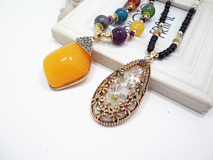 European and American ethnic style imitation beeswax color shell long sweater chain autumn and winter retro water drop necklace jewelry wholesale