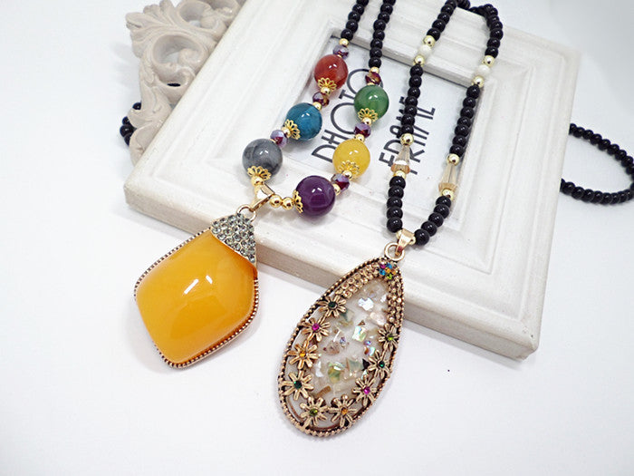 European and American ethnic style imitation beeswax color shell long sweater chain autumn and winter retro water drop necklace jewelry wholesale