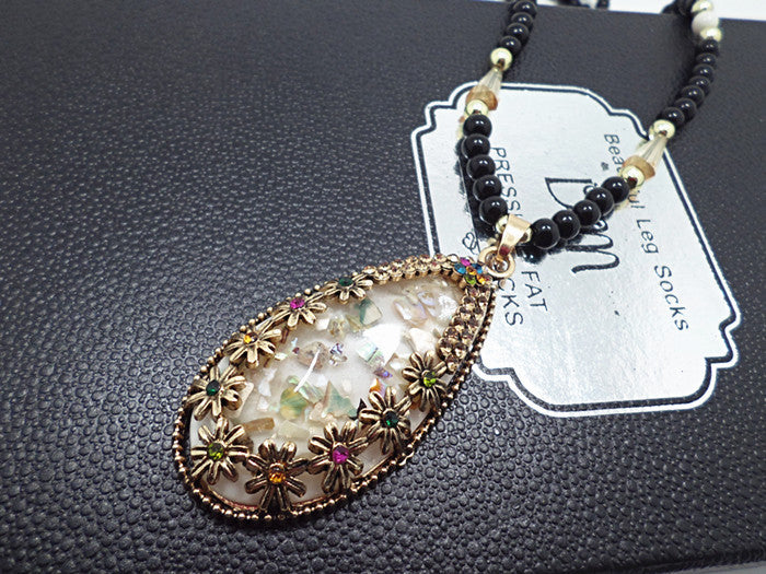 European and American ethnic style imitation beeswax color shell long sweater chain autumn and winter retro water drop necklace jewelry wholesale