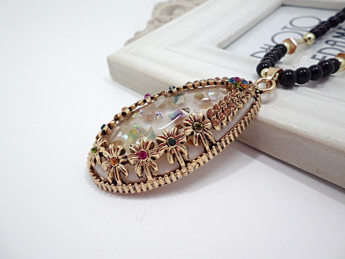 European and American ethnic style imitation beeswax color shell long sweater chain autumn and winter retro water drop necklace jewelry wholesale