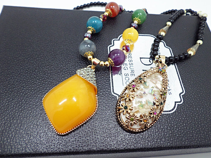 European and American ethnic style imitation beeswax color shell long sweater chain autumn and winter retro water drop necklace jewelry wholesale