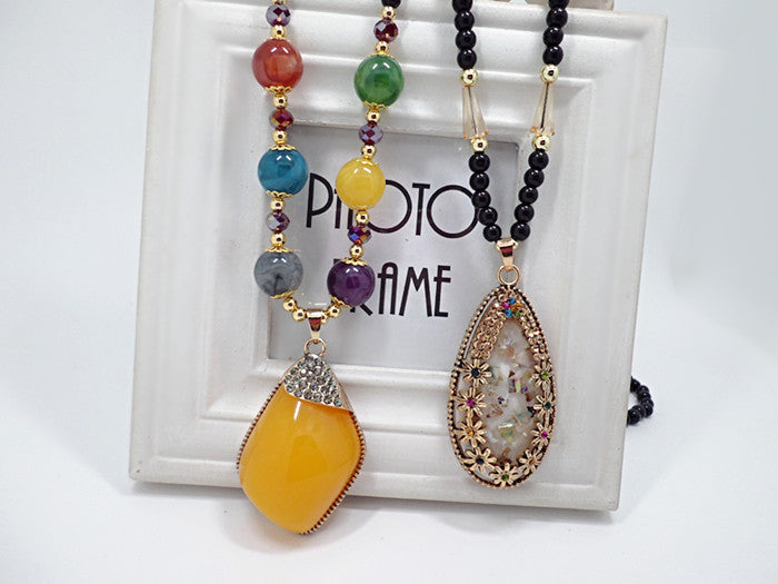 European and American ethnic style imitation beeswax color shell long sweater chain autumn and winter retro water drop necklace jewelry wholesale