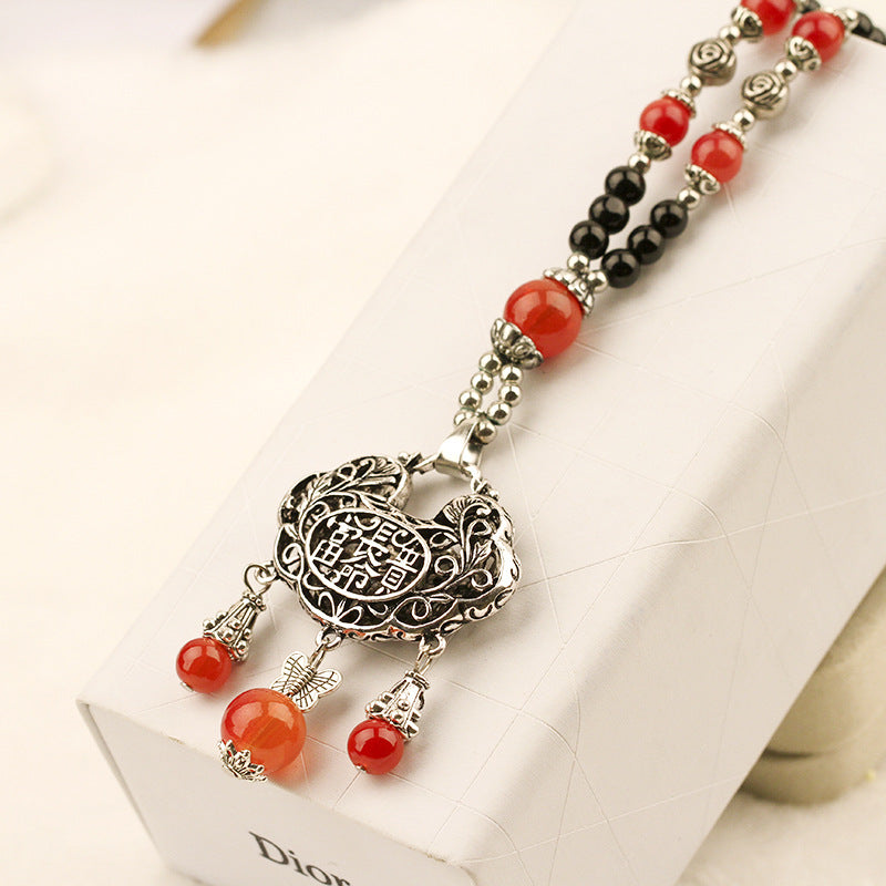 European and American ethnic style imitation beeswax colored shell long sweater chain autumn and winter retro water drop necklace jewelry wholesale