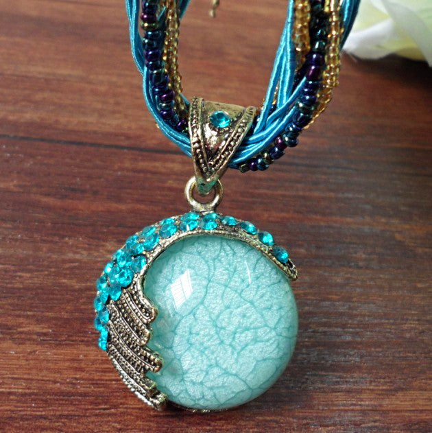 European and American ethnic style imitation beeswax colored shell long sweater chain autumn and winter retro water drop necklace jewelry wholesale