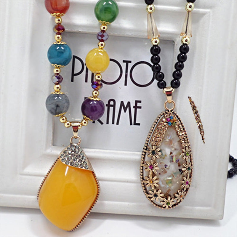 European and American ethnic style imitation beeswax color shell long sweater chain autumn and winter retro water drop necklace jewelry wholesale