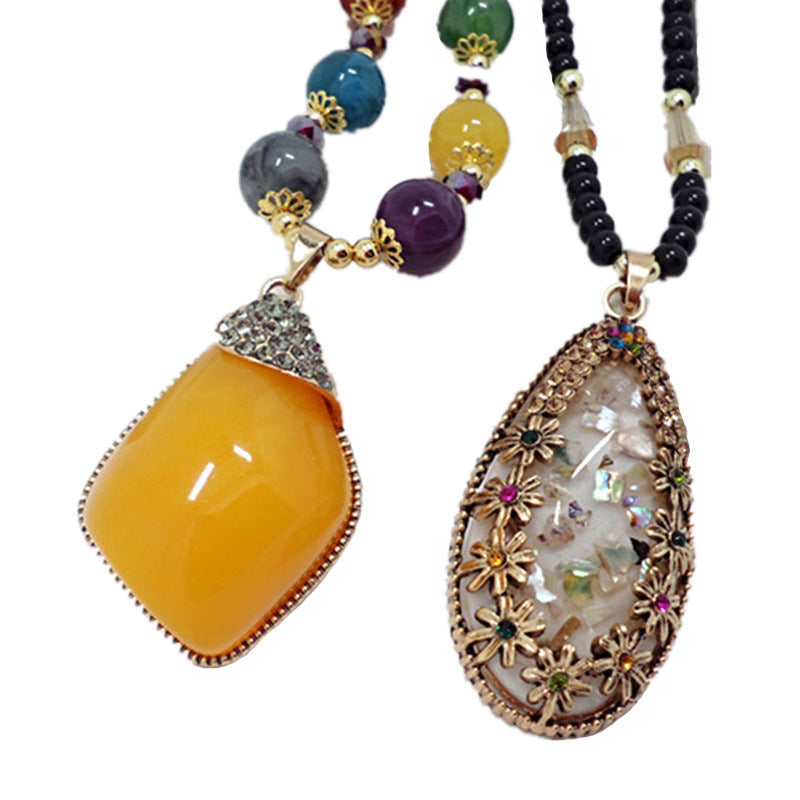 European and American ethnic style imitation beeswax color shell long sweater chain autumn and winter retro water drop necklace jewelry wholesale