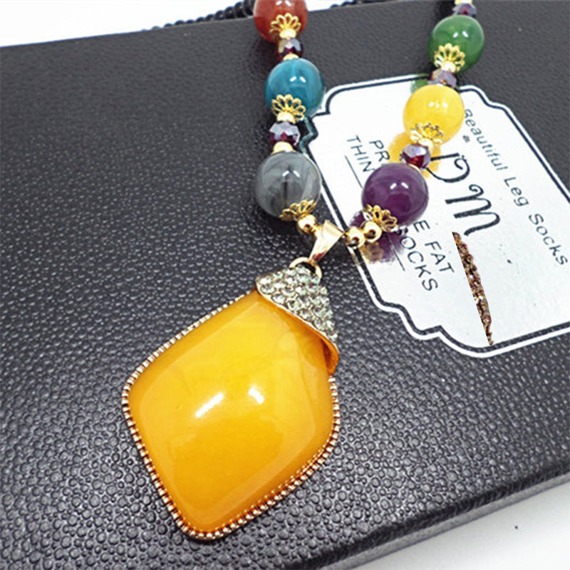 European and American ethnic style imitation beeswax color shell long sweater chain autumn and winter retro water drop necklace jewelry wholesale