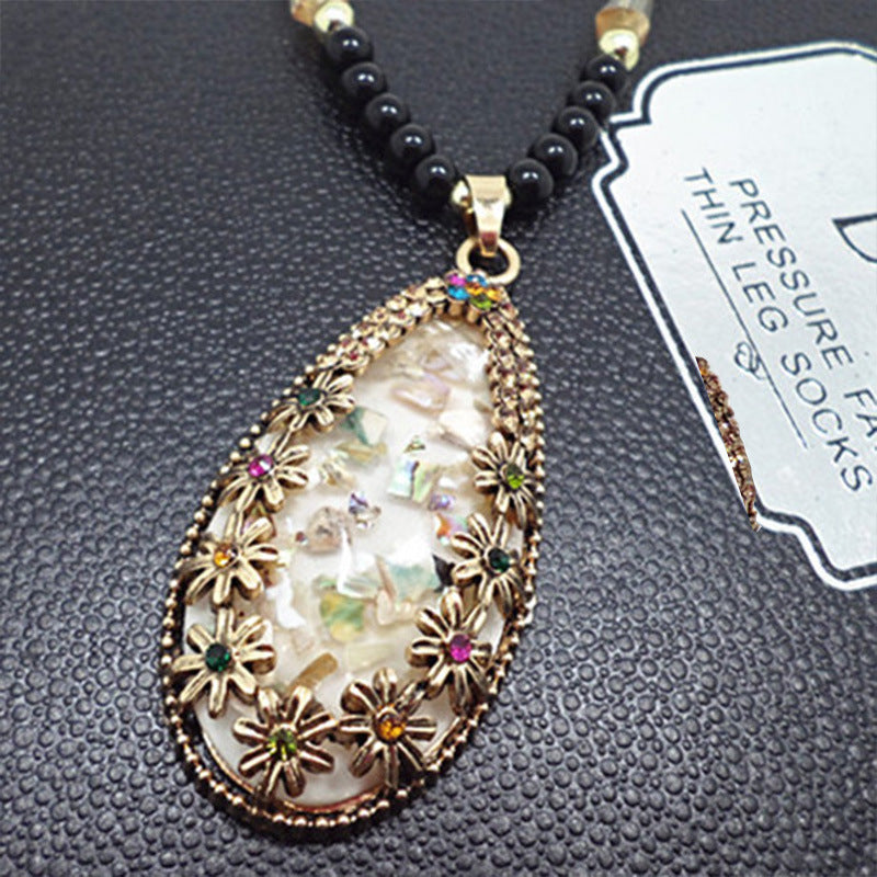European and American ethnic style imitation beeswax color shell long sweater chain autumn and winter retro water drop necklace jewelry wholesale