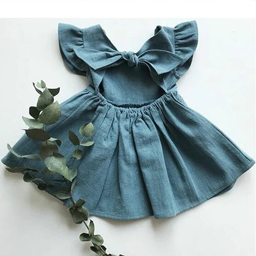 Le ragazze infantili estive in stile coreano vestono i vestiti da festa per bambini in cotone e lino con maniche volanti