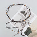 Cintura Etnica Intrecciata con Conchiglie e Nappine - Donna
