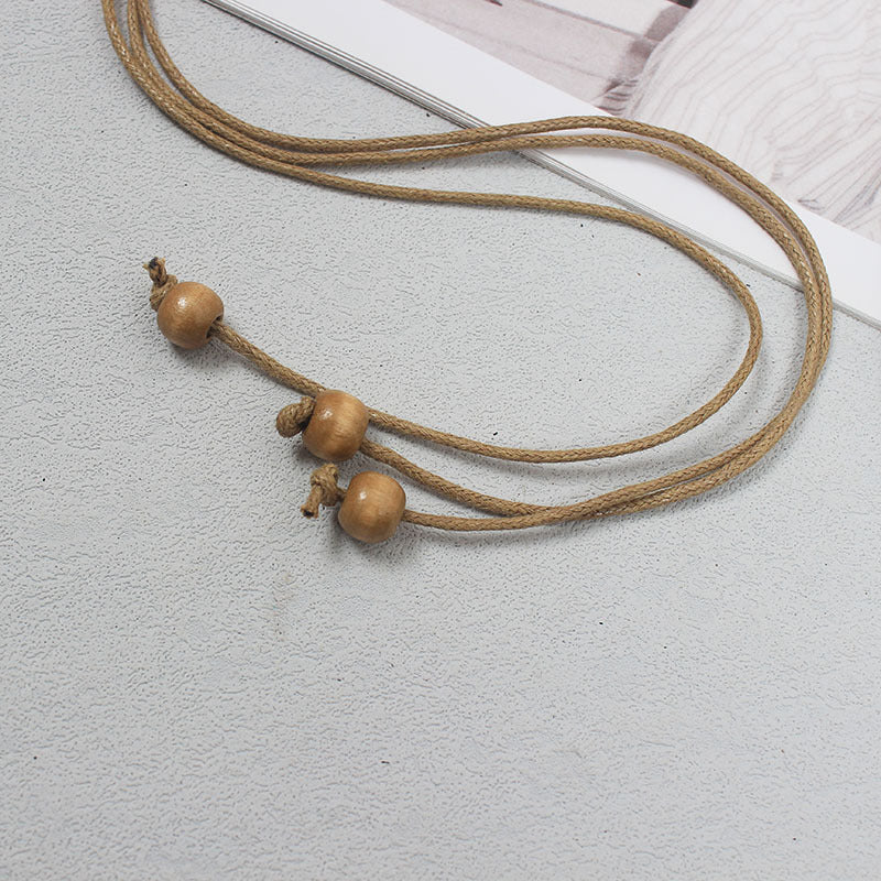 Cintura Etnica Intrecciata con Conchiglie e Nappine - Donna