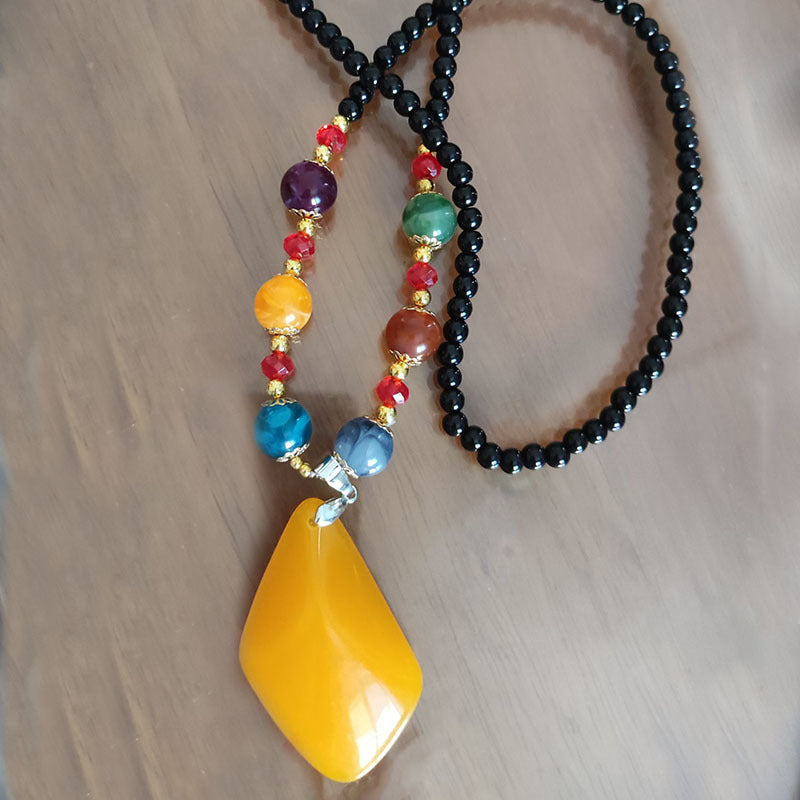 European and American ethnic style imitation beeswax colored shell long sweater chain autumn and winter retro water drop necklace jewelry wholesale