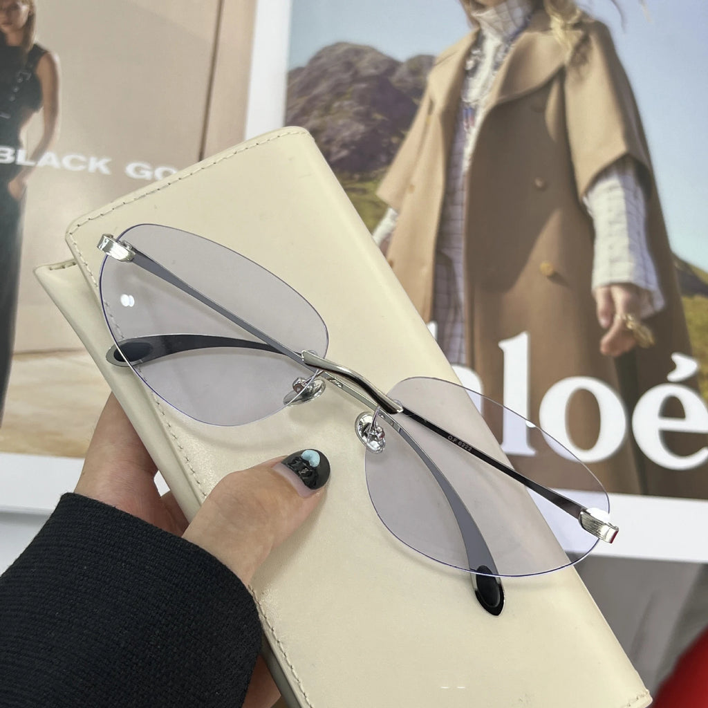 Occhiali da sole senza montatura Y2K da donna Occhiali da sole senza montatura di marca di lusso Futuro stili coreani Cat Eye Occhiali UV400 Occhiali alla moda