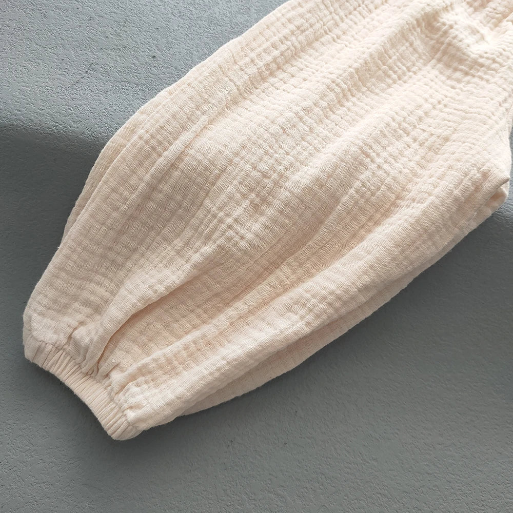 Pantaloni estivi per bambini coreani Pantaloni casual per ragazze Ragazzi in cotone e lino Tinta unita Pantaloni larghi a pieghe Pantaloni Harem a vita alta per ragazze