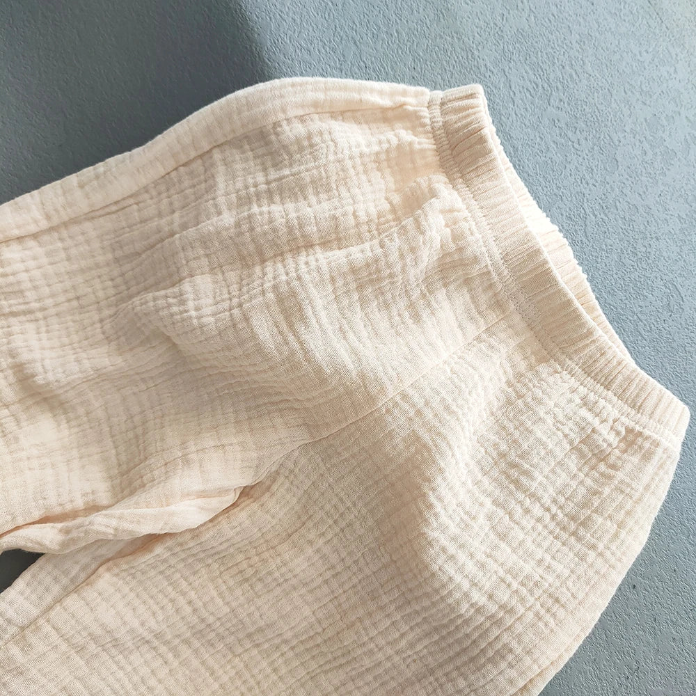 Pantaloni estivi per bambini coreani Pantaloni casual per ragazze Ragazzi in cotone e lino Tinta unita Pantaloni larghi a pieghe Pantaloni Harem a vita alta per ragazze