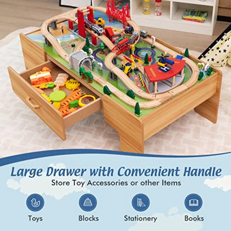 Tavolo ferroviario per la stanza dei giochi dei bambini, in legno con finitura naturale, dotato di piano ribaltabile, cassetto portaoggetti e tracciato ferroviario.
